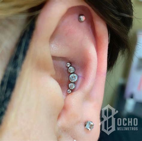 arito en la concha|Piercing Conch : dolor, curación, tipos de joyas,